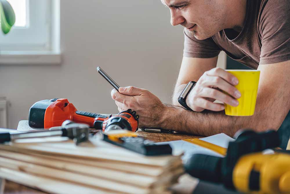 Man using device to help with DIY