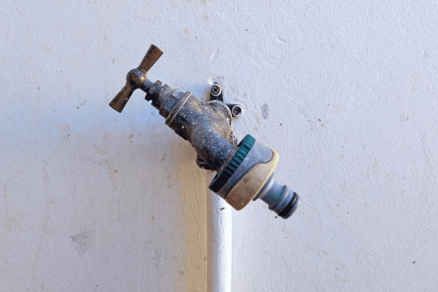 An old, broken outside tap