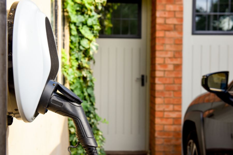 An electric car connected to a home electric car charger 
